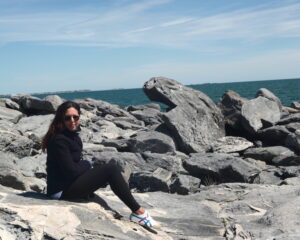 Meg on rocks in Newport