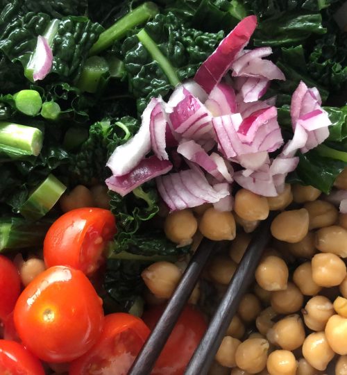 Chickpea summer salad with all fresh ingredients. Fresh Tomatoes, red onion, kale salt, pepper and olive oil